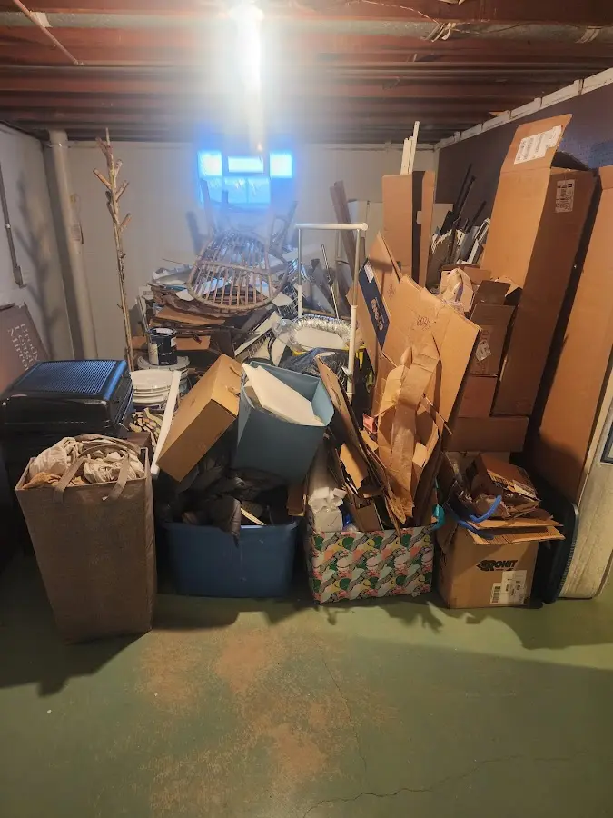 Roll-off dumpster container at job site for 2 Yard Dumpster Rental in Norwich